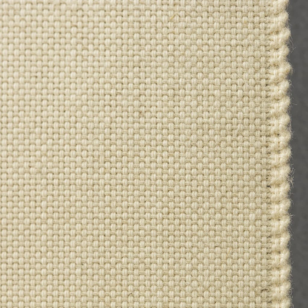 Close detail of a woven fabric's grain and selvedge edge