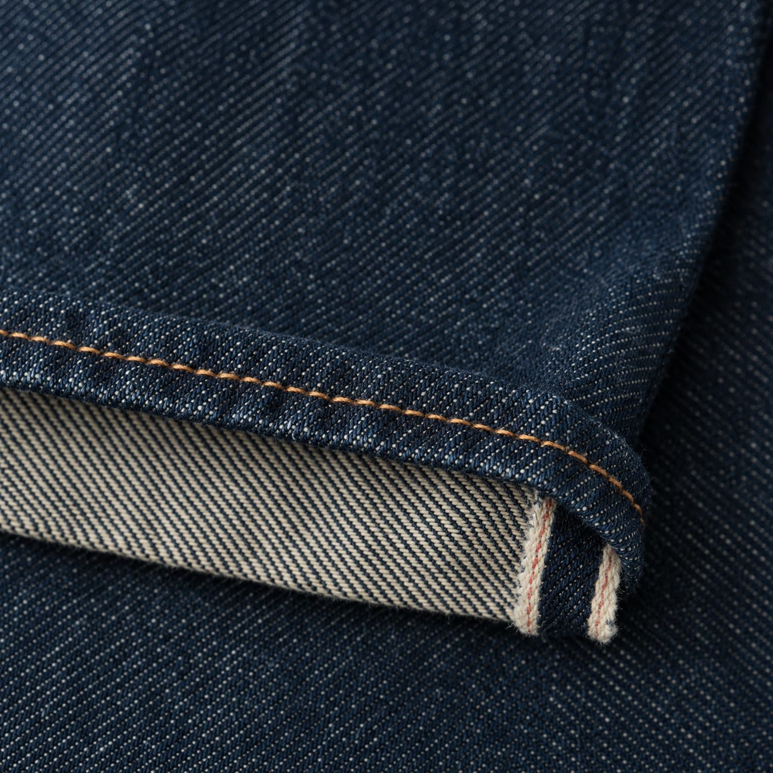 Macro detail of denim weave and selvedge