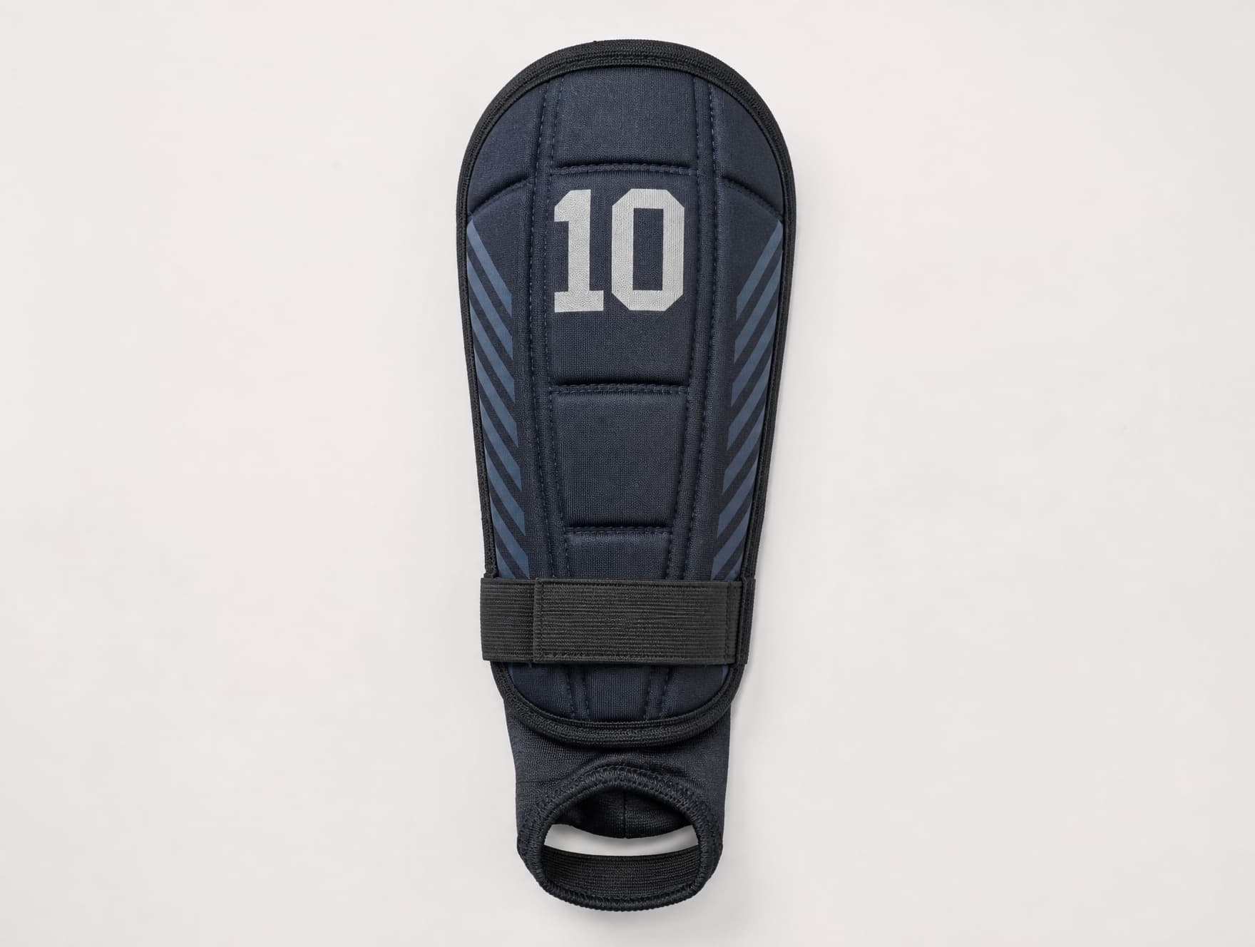 A football shin guard showing panel construction